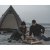 Cooking under the open sky – enjoy a lovely outdoor meal by the fire with the Easy Camp Otra Tipi as a cozy backdrop.