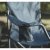 The sturdy steel frame provides stability, while wide armrests and a cup holder offer extra comfort.