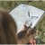 The compass has a rotating bezel and a large magnifying lens.