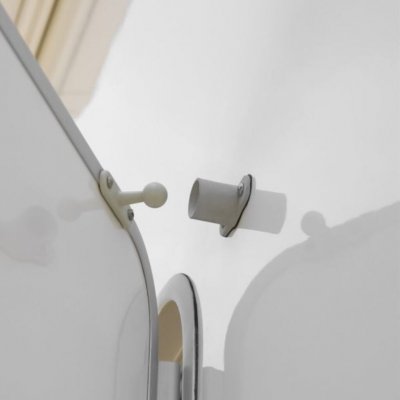 Can also be attached at the top of the door.