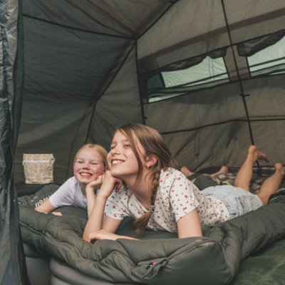 Spacious sleeping cabin with good ventilation and dark fabric.