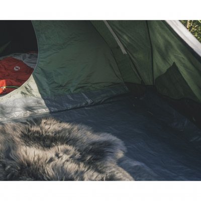 A corner of the sleeping cabin in the Outwell Cloud 3 with a glimpse of the comfortable floor of the awning – perfect for extra