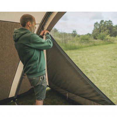 Adjustment of the curtains with zippers on the front door for customized light entry and privacy protection.