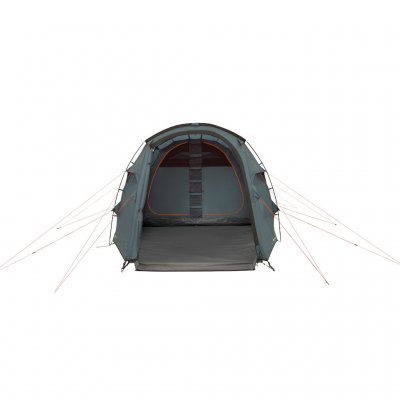 Large front door open - large living room and darkened sleeping cabin with storage options