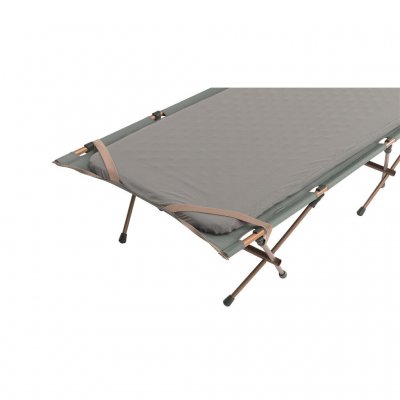 Corner straps hold an insulated sleeping pad in place when used in cold conditions