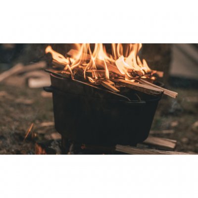 Place embers or fire on top to heat from two sides.