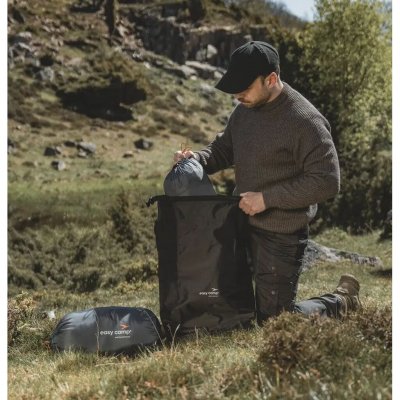 The bag features taped seams and a roll-top closure that protects larger gear from water.