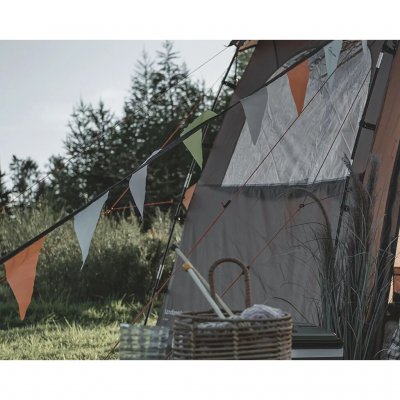 Bunting with colourful flags that creates a festive atmosphere while glamping.