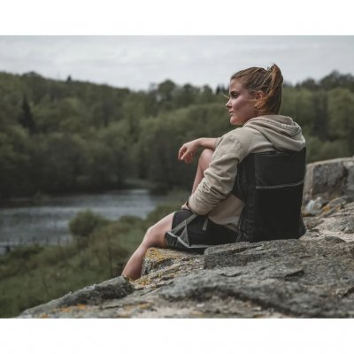 The chair features a mesh pocket for storage on the back of the backrest.