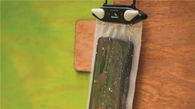 Storage bag with carrying strap for mobile phone.