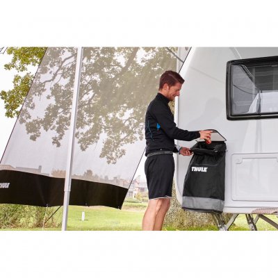 Attach the Thule bin outside to the caravan or motorhome.