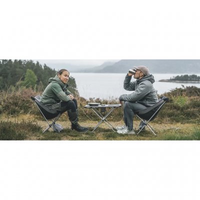 Small and low table with a steel frame and cup holders for two people.