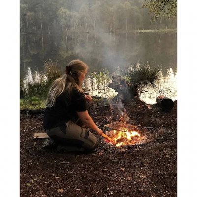 Lightweight and compact stainless steel grill grate for open fire or ember bed.