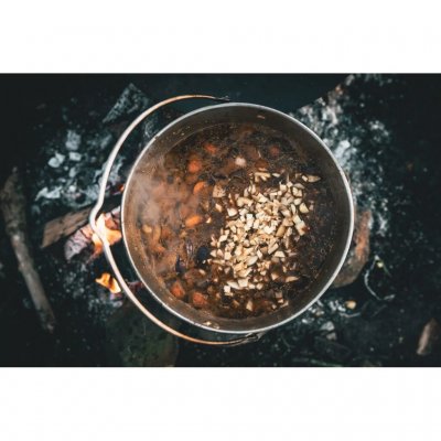 The pot has a handle with an attachment point for hanging over the fire.